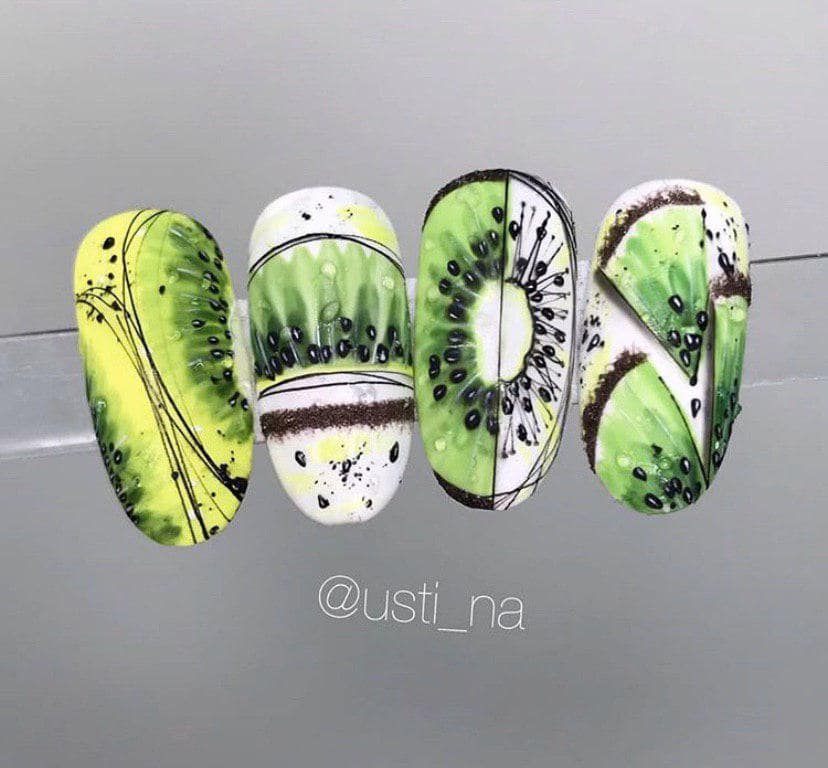 Маникюр с киви в разрезе на белом фоне